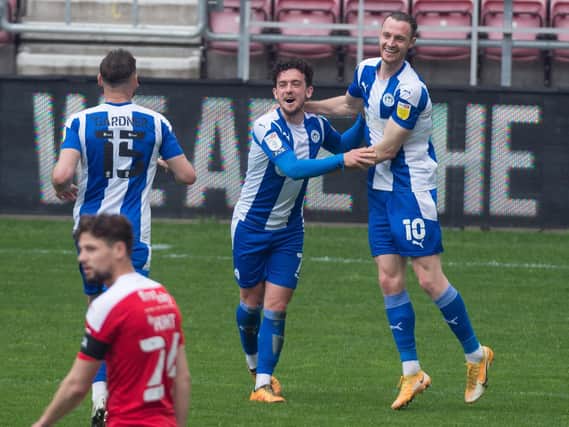 Zach Clough scores for Latics on the final day of the campaign against Swindon