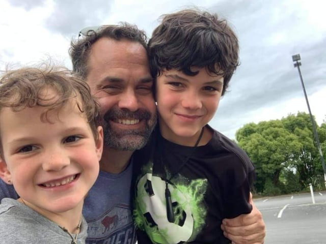 Chris with his children Wyatt, six, and Roark, 10