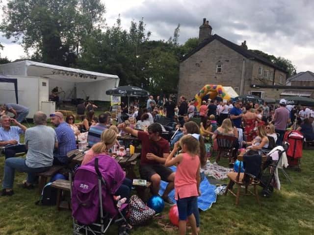 People enjoying a music festival in the former beer garden of The Old Springs