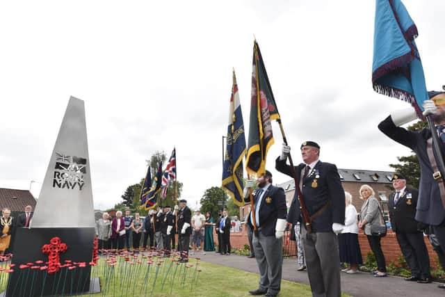 Standards on display at the monument in the memorial garden