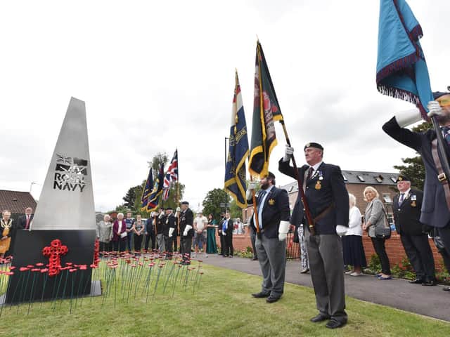Standards on display at the monument in the memorial garden