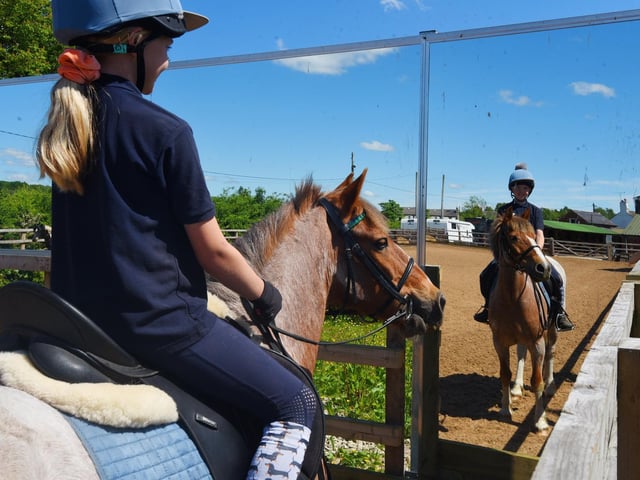 Ursula Morris, 10, on her pony Skippy, in the paddock with mirrors at Parbold Equestrian Centre