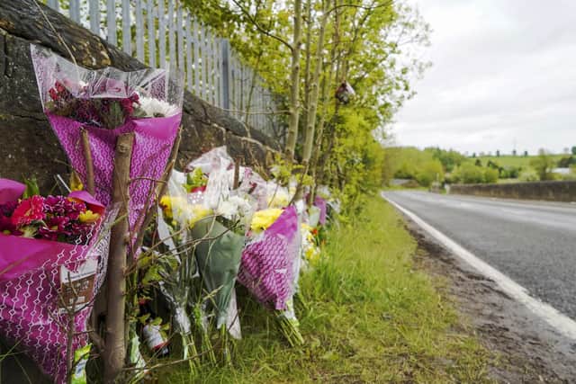 Flowers left at the site of a road traffic collision