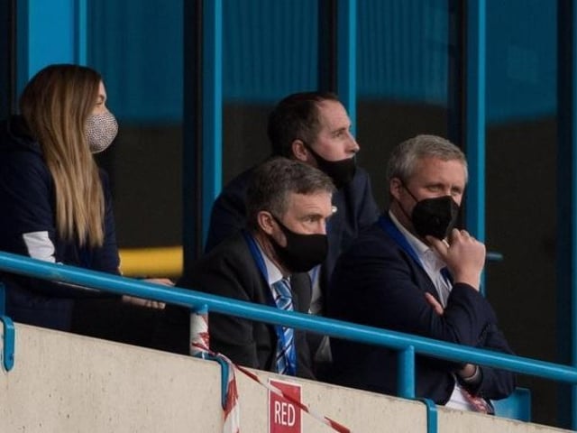 Dr Tom Markham (far right) watches last season's defeat at Gillingham