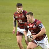 Tony Clubb drives up the ball