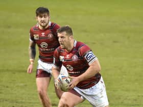 Tony Clubb drives up the ball