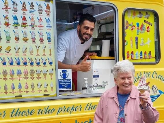 Raheim Iqbal of Martin's Whippy with a resident at Barley Brook