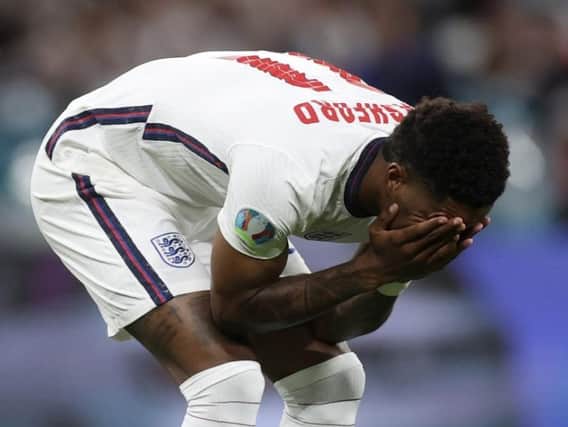 Marcus Rashford reacts after missing his penalty