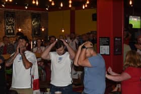 Not our night - fans in Wigan react to the penalty shoot-out in the Euros final