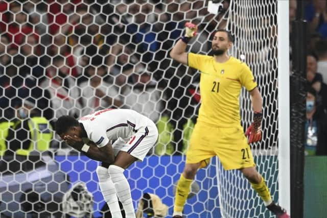 Marcus Rashford reacts after his penalty miss against Italy