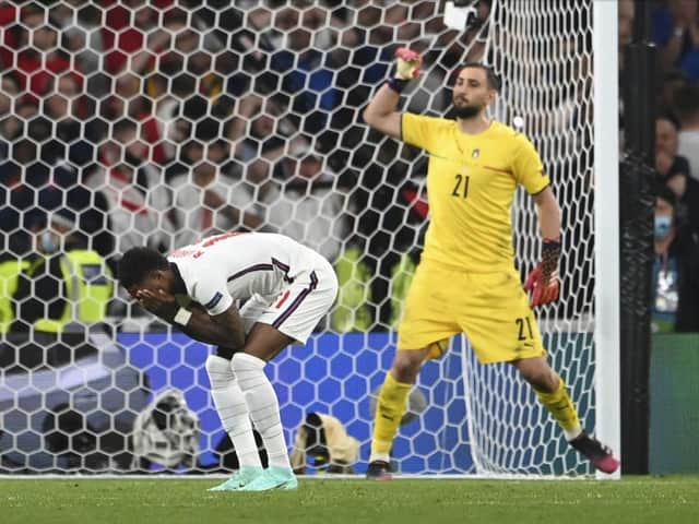 Marcus Rashford reacts after his penalty miss against Italy