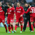 Callum McManaman celebrates reaching the FA Cup final in 2013 with, among others, Graeme Jones