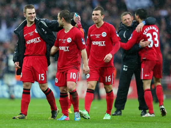 Callum McManaman celebrates reaching the FA Cup final in 2013 with, among others, Graeme Jones