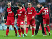 Callum McManaman celebrates reaching the FA Cup final in 2013 with, among others, Graeme Jones