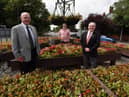Wigan Councillors Michael McLoughlin, left, and George Davies, right, with local resident Dave Calder at the Cherry Gardens roundabout