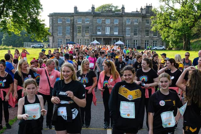 Runners and walkers set off outside Haigh Hall