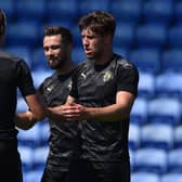 Callum Lang is congratulated after putting the Latics of Wigan 2-0 up at Oldham