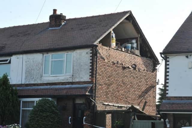The gable end of the house which collapsed