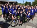 Olly Johnson cheers on the cyclists