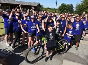 Olly Johnson cheers on the cyclists