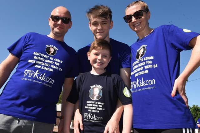 Olly Johnson with parents Phil and Donna and brother Callum,18
