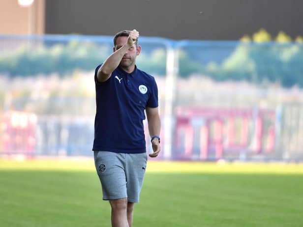Leam Richardson acknowledges the Latics fans at Fylde