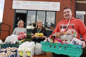 Coun Steve Jones, right, with Anthea Caffrey, left, and Gill Williams from Bryn Support Centre, food larder and community shop, offering food parcels for members of the community