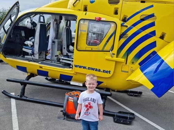 Ellery Parkinson with the air ambulance helicopter