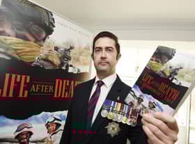 Coun James Paul Watson with his new book