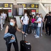 Tourists arrive at Son Sant Joan airport in Palma de Mallorca on June 28, 2021