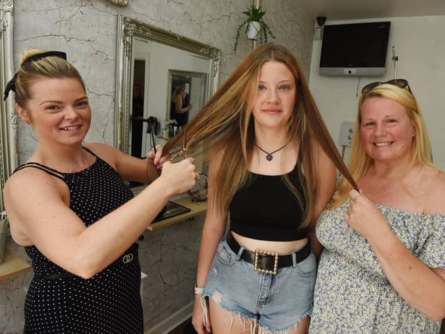 Molly Catterall, centre, with Leah-Marie Thompson, owner of Leah-Marie Hair and Beauty, Hindley and mum Karen Winterflood
