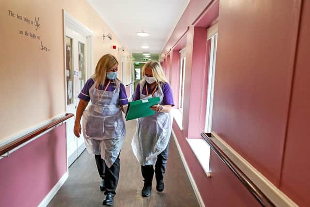 Staff in a Lowton care home. Photo by PA