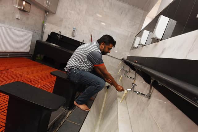 Esmail Lakdawala in the wash room