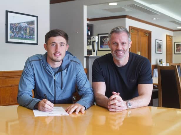 James Carragher signs pro forms with Latics, watched by his proud dad Jamie