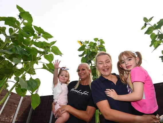 Becky Chew, second from left, with daughters Summer, two, and Esmae, five, and friend Abbie Jackson