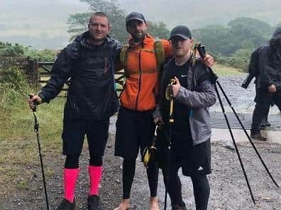 Michael Healy (centre) with pals Adam and David who also completed the challenge