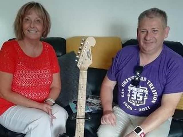 Martin and Marise Gevaux, who won the auction for the guitar