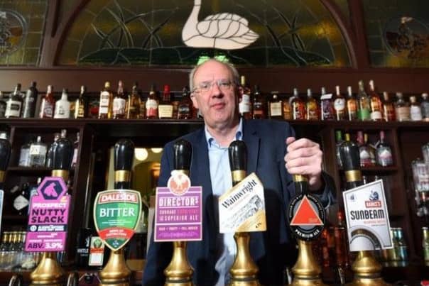 Owner John Brearley inside the Swan and Railway