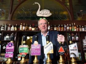 Owner John Brearley inside the Swan and Railway