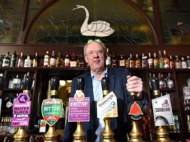 Owner John Brearley inside the Swan and Railway