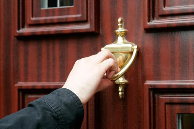 People are urged to be careful when cold callers knock on their door
