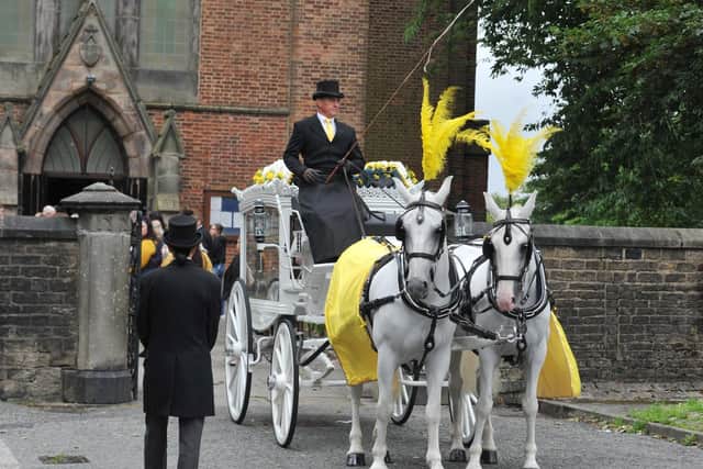 A horse-drawn carriage led the procession to the church