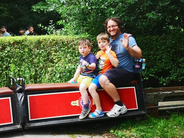 A family enjoys a ride on the train