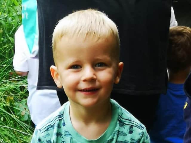 Four-year-old Alfie Richardson waits his turn