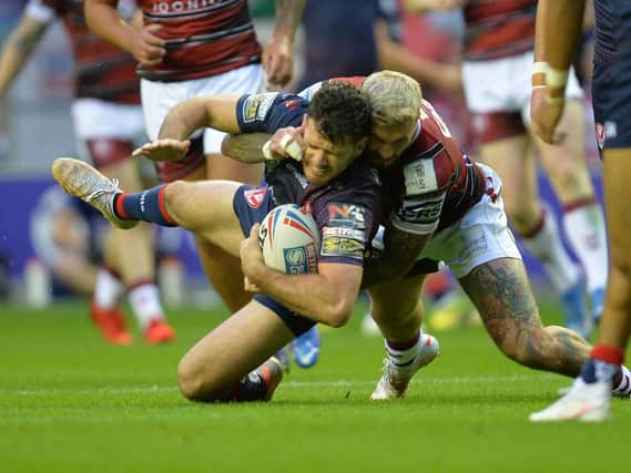 Zak Hardaker tackles counterpart Lachlan Coote