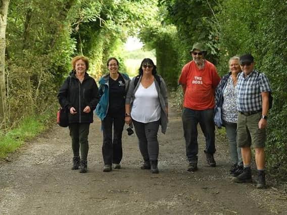 Carers enjoy the great outdoors during a walk in the woods