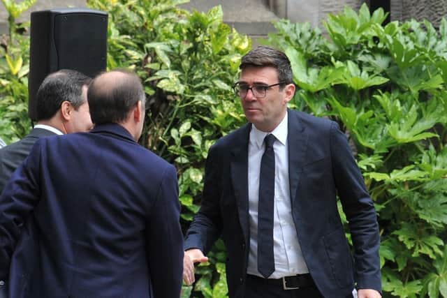 Greater Manchester Mayor Andy Burnham arrives to pay his respects