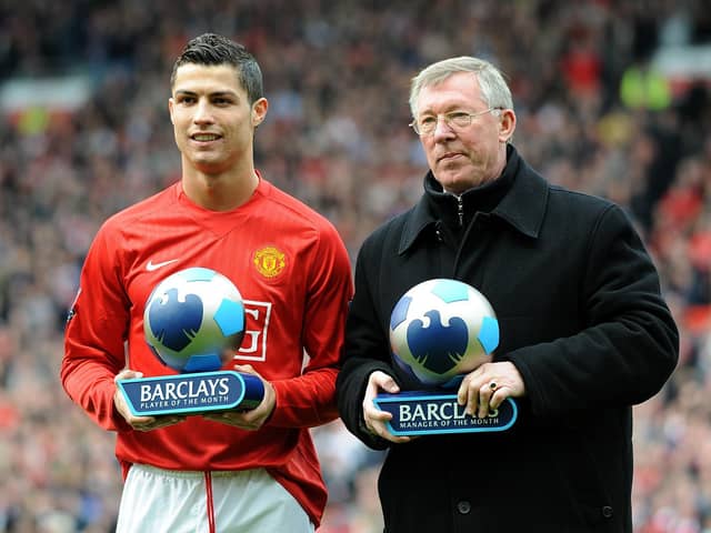 Manchester United's Alex Ferguson and Cristiano Ronaldo receive their manager and player of the month trophies in 2008