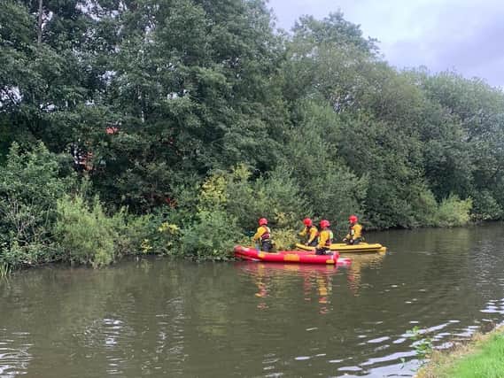 Specialist water rescue teams helped to get to the bird. Pic: GMFRS