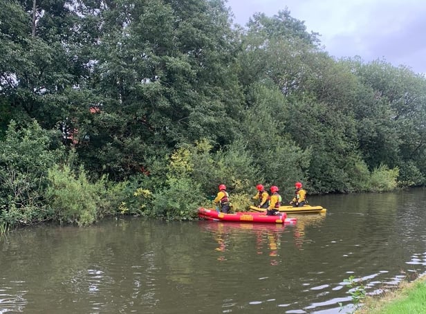 Specialist water rescue teams helped to get to the bird. Pic: GMFRS